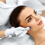 Face Skin Care. Close-up Of Woman Getting Facial Hydro Microdermabrasion Peeling Treatment At Cosmetic Beauty Spa Clinic. Hydra Vacuum Cleaner. Exfoliation, Rejuvenation And Hydratation. Cosmetology.