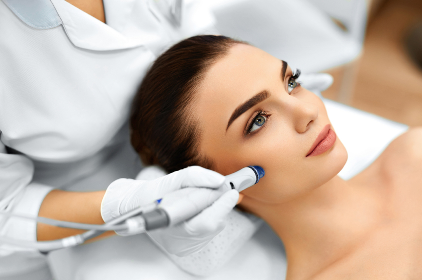 Face Skin Care. Close-up Of Woman Getting Facial Hydro Microdermabrasion Peeling Treatment At Cosmetic Beauty Spa Clinic. Hydra Vacuum Cleaner. Exfoliation, Rejuvenation And Hydratation. Cosmetology.